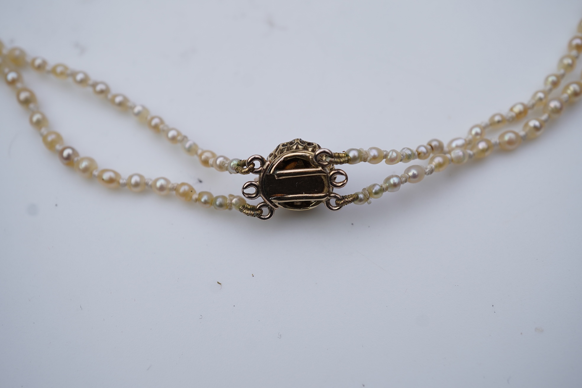 A natural pearl and diamond necklace, early 20th century